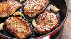 steaks and potatoes cooking in a skillet