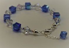 a bracelet with blue glass beads and silver accents