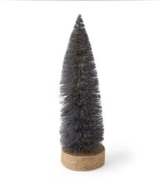 a small silver tree on a wooden stand with rope around it's base and bottom