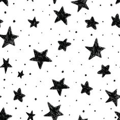 black and white stars drawn in chalk on a sheet of paper with polka dot dots