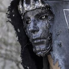 a close up of a person's face with black paint on it