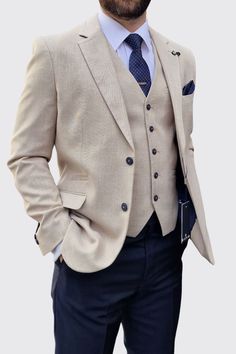 Cavani Miami Beige Three Piece Suit with Navy Trousers Elevate your style with the Cavani Miami Beige Three Piece Suit with Navy Trousers. This luxurious combination of a beige jacket and waistcoat paired with slim navy trousers creates a sophisticated and unforgettable look. Perfect for special occasions, the stunning mix and match design exudes elegance and refinement. Whether attending an intimate gathering or a grand celebration, this timeless suit will make you stand out from the crowd. Mak Suits For Men Stylish Wedding Guest, Linen Three Piece Suit, Cream Suit Jacket Navy Pants Men, Mens Suit Mix And Match, Black And Beige Suits For Men, Champagne Wedding Groom, Three Piece Groom Suit, Oatmeal Groomsmen Suits, Two Tone Suit Men Wedding