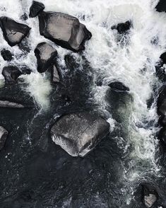 the water is rushing over rocks and boulders