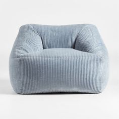 a blue corded chair sitting on top of a white floor