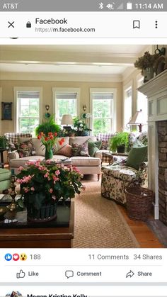 a living room filled with lots of furniture and flowers on top of the couches