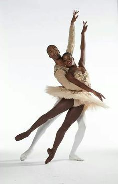 two ballerinas are posing for a photo