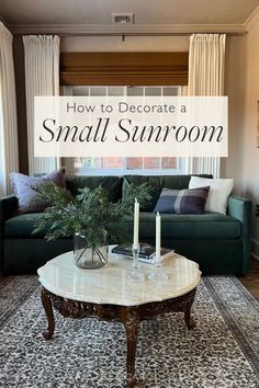 a living room with a green couch and coffee table in front of a window that says how to decorate a small sunroom