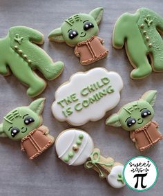 decorated cookies with the words, the child is coming and baby yoda on them