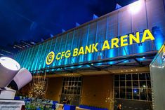 a bank arena sign is lit up at night