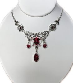 "This lovely necklace is made with antiqued silver plated filigrees, adorned with dazzling DARK RUBY RED glass rhinestones and jewels. Decorated portion measures 5\" wide and 2 1/8\" tall in the center. It is adjustable 15\" to 18\" in length and fastens with a lobster clasp. This is available in a variety of stone colors in our store, along with matching earrings and headpieces. If you don't see something with the stone color you'd like, feel free to send us a message." Hippie Goth, Victorian Necklace, Medieval Jewelry, Choker Pendant, Red Necklace, Red Jewelry, Neck Jewellery, Bridesmaid Wedding, Wedding Jewellery Necklace