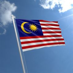 the malaysian flag is flying high in the sky