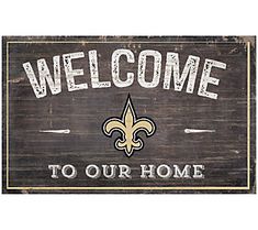 a wooden sign that says welcome to our home with a fleur de lis on it