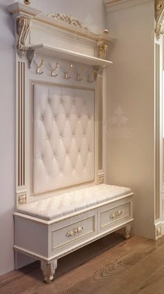 a white bench sitting in the middle of a room next to a wall mounted mirror