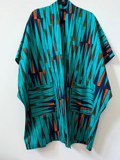 Up your style with this beautifully unique Kimono - they always make a statement! Crafted from African Wax Print fabric. Style with jeans, a skirt or dress. Open front Midi length Kimono style Relaxed, oversized fit Lightweight Short sleeves Patch front pockets 100% Cotton. One Size. Length = 38.5" Kimono Ankara Styles, African Kimono, Unique Kimono, Kimono Styles, African Print Kimono, Moda Kimono, Diy Kimono, African Wax Print Fabric, Mode Kimono