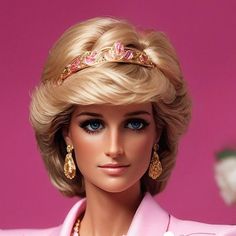 a barbie doll with blonde hair wearing a pink suit and tiara on her head