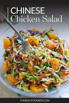 a close up of a salad in a bowl on a table with the words chinese chicken salad above it