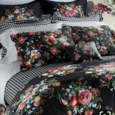 a black and white bed with flowers on it