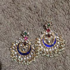 This Earring Is Designed With Ruby, Emerald, Freshwater Pearl And Blue Meenakari Work. Blue Earrings For Celebration Festivals, Blue Earrings For Festivals And Celebrations, Festive Blue Jeweled Earrings, Traditional Blue Danglers For Pierced Ears, Traditional Blue Danglers, Blue Festive Danglers, Traditional Blue Round Earrings, Blue Dangle Earrings For Festivals, Blue Dangle Danglers For Festivals