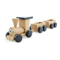 a wooden toy train with black wheels and eyes on the front, sitting next to two smaller ones