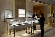 two women looking at jewelry in a store