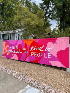 a pink fence with hearts painted on it and the words, kind of people are kind of people