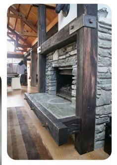 a stone fireplace in the middle of a room