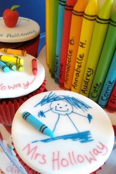 cupcakes decorated with crayons and writing on them