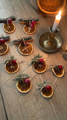 several pieces of fruit on a table with a lit candle