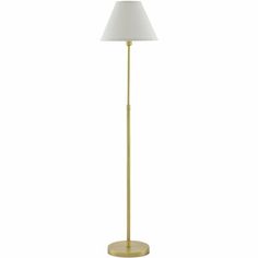 a gold floor lamp with a white shade