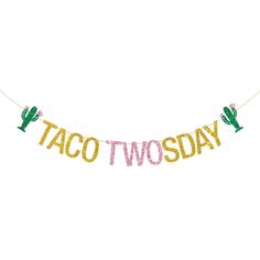 a banner that says taco two day hanging from a string