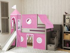 a child's bedroom with a pink castle bed and slide