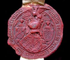 a red seal with an animal on it