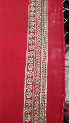 red and gold sari with golden thread on it