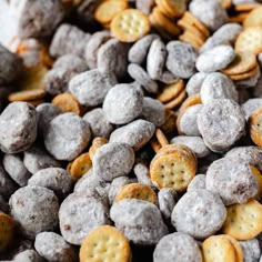 a pile of dog food with some crackers in it's middle and other snacks on the side