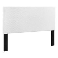 an upholstered headboard with black legs and white fabric on the bottom half