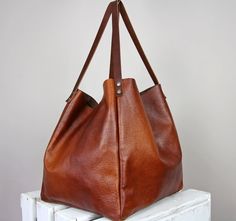 "Brown large bag, Cognac brown owersized bag, women weekender bag Dimension details: Max width at the top: 60 cm / 23.6\" Height: 35 cm / 13,5\" Depth:25 cm / 10\" Handle drop: 29 cm / 11,5\" Brown Over sized city type bag. Adorable and very fashionable this season large bag will make you feel special with her. A large, spacious bag for carrying books, laptops or shopping. The bag is so beautiful that you can just wear it empty, because it is soft and very pleasant in the end. The distressed lea Brown Large Capacity Shoulder Bag For Weekend, Brown Weekender Bag With Large Capacity For Everyday, Brown Weekender Bag With Large Capacity, Brown Large Capacity Bag For Weekend, Brown Large Capacity Weekender Bag, Leather Weekender Bag For Errands, Brown Shoulder Weekender Bag For Everyday, Everyday Brown Shoulder Weekender Bag, Weekend Rectangular Shoulder Bag With Leather Handles