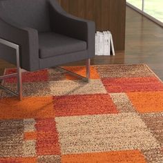 a chair sitting on top of a rug in a living room