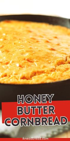 honey butter cornbread in a cast iron skillet with text overlay that reads honey butter cornbread