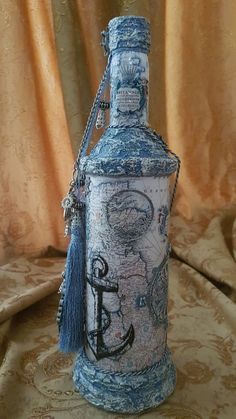 a blue bottle sitting on top of a table