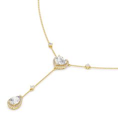 Inspired by a lariat necklace, this piece has a Y-shaped silhouette and two sparkling pendants. The chain necklace holds a heart pendant dotted at the center with a heart-cut diamond framed by a heart-shaped halo of petite round diamonds. Gently dropping from the heart pendant is a pear-cut diamond haloed by round diamonds. This necklace is a piece of everyday fine jewelry that can effortlessly enhance your daily wardrobe. Diamond Pendent, Heart Shaped Pendant, Gorgeous Engagement Ring, Pear Cut Diamond, Heart Shape Pendant, Lariat Necklace, Pear Cut, Diamond Heart, Diamond Earrings Studs