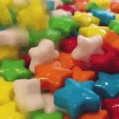 there are many different colored candies on the table