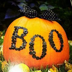 a pumpkin with the word boo spelled out on it