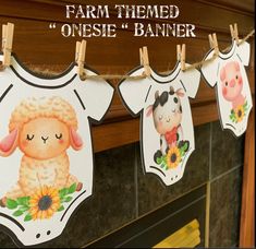 baby onesie banners hanging from clothesline with farm themed animals and sunflowers