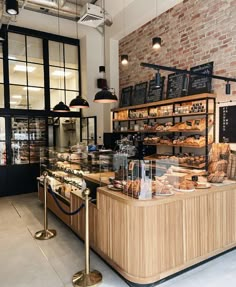 a bakery with lots of breads and pastries on display