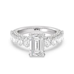 an emerald cut diamond ring with side stones