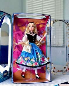 a barbie doll in a box on a table