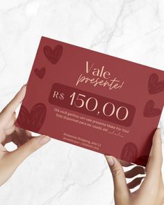 two hands holding up a valentine's day card with the words vale presente $ 350, 000