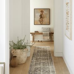 the hallway is clean and ready for us to use as an entrance way in this home