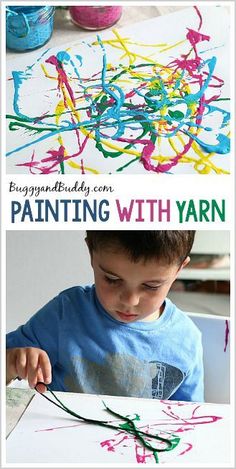 a young boy is painting with yarn