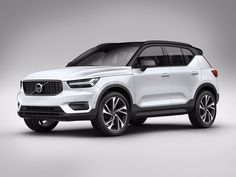 a white volvo suv parked in front of a white background